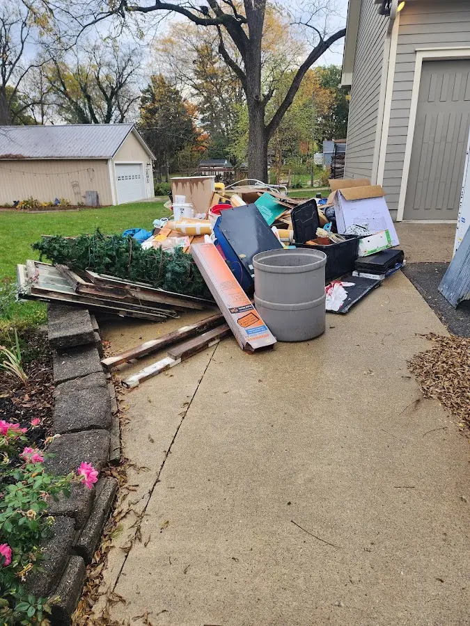 Dumpster being loaded with debris for 30 Yard Dumpster Rental in Delphi